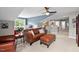 Inviting living room featuring a leather sofa set and lots of natural light from large windows at 1504 Hemlock Hill Dr, Durham, NC 27703