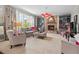 Elegant living room boasts a stone fireplace, built-in shelving, and bright, natural light from large windows at 1504 Hemlock Hill Dr, Durham, NC 27703