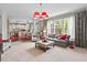 Open-concept living room leads to a modern kitchen, with ample seating and lots of natural light at 1504 Hemlock Hill Dr, Durham, NC 27703