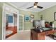 Inviting office featuring french doors to dining room, carpet flooring, and functional decor for a productive work environment at 1504 Hemlock Hill Dr, Durham, NC 27703