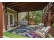 Cozy patio area featuring a grill, outdoor seating, and convenient access to the home with a charming patio rug at 1504 Hemlock Hill Dr, Durham, NC 27703