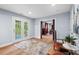 Bright sitting area with french doors, leading to an adjacent room at 1504 Hemlock Hill Dr, Durham, NC 27703