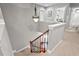 Carpeted staircase with a decorative railing leading to the upper level of the home at 1504 Hemlock Hill Dr, Durham, NC 27703