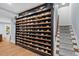 Elegant wine cellar with wooden shelves and stylish lighting, perfect for storing and showcasing your wine collection at 1504 Hemlock Hill Dr, Durham, NC 27703