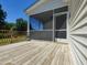 The back deck overlooks an expansive fenced yard and beautiful trees at 160 Inverness St, Zebulon, NC 27597
