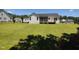 Spacious backyard featuring green grass, a fence, and a view of the house at 160 Inverness St, Zebulon, NC 27597