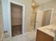 Bright bathroom with a walk in shower, closet and tile floor at 160 Inverness St, Zebulon, NC 27597
