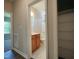 Hall bathroom featuring a tub-shower combo, a wood vanity, and a tile floor at 160 Inverness St, Zebulon, NC 27597