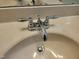Close up of the bathroom sink and faucet with a white sink and chrome faucet handles and fixtures at 160 Inverness St, Zebulon, NC 27597