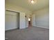 Bedroom featuring carpet, and a large closet at 160 Inverness St, Zebulon, NC 27597