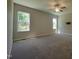 Spacious bedroom with carpet, ceiling fan, two windows providing natural light and ceiling fan at 160 Inverness St, Zebulon, NC 27597