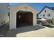Exterior view of a detached one-car garage with an open door and a car parked next to it at 160 Inverness St, Zebulon, NC 27597