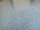 Close-up of a durable gray epoxy garage floor, providing a sleek and easy-to-maintain surface at 160 Inverness St, Zebulon, NC 27597