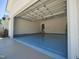 Spacious and empty garage with a modern door provides ample parking and storage options at 160 Inverness St, Zebulon, NC 27597