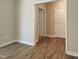 Hallway showing multiple entry doors, wooden trim and modern flooring at 160 Inverness St, Zebulon, NC 27597