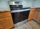 Stainless steel range with glass cooktop and oven in kitchen with granite countertops at 160 Inverness St, Zebulon, NC 27597