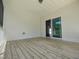 View of the screened porch featuring a sliding door that leads into the home at 160 Inverness St, Zebulon, NC 27597