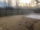 Spacious backyard with a wood fence and a concrete patio, perfect for outdoor entertaining at 185 Bourne Dr, Franklinton, NC 27525