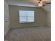 Bright bedroom features a fan, window with blinds, neutral paint and plush carpet at 185 Bourne Dr, Franklinton, NC 27525