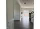 Inviting hallway leading to the living spaces, enhanced by hardwood floors and stylish wall trim at 185 Bourne Dr, Franklinton, NC 27525