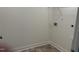 A practical laundry room with tile flooring and convenient hookups for your machines at 185 Bourne Dr, Franklinton, NC 27525