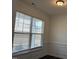 Living room featuring crown molding and a large window for ample natural light at 185 Bourne Dr, Franklinton, NC 27525