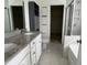 Main bathroom features granite countertops, double vanity, tub and glass shower at 185 Bourne Dr, Franklinton, NC 27525