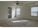 Spacious main bedroom features tray ceiling, ceiling fan and lots of natural light at 185 Bourne Dr, Franklinton, NC 27525
