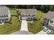 Aerial view of a well-maintained home with a spacious yard and neighborhood setting at 185 Twilight Trl, Willow Springs, NC 27592