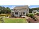 A backyard with lush greenery, a well-maintained lawn, and a charming patio area, perfect for outdoor enjoyment at 185 Twilight Trl, Willow Springs, NC 27592