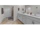 Bathroom with double sink vanity, ample counter space, and a glass enclosed shower at 185 Twilight Trl, Willow Springs, NC 27592