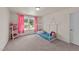 Bright bedroom featuring a toddler bed, plush carpeting and a window letting in plenty of natural light at 185 Twilight Trl, Willow Springs, NC 27592