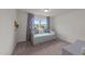 Neutral bedroom with a daybed, soft blue cushions, and carpeted floors at 185 Twilight Trl, Willow Springs, NC 27592