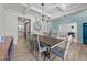 Elegant dining room with coffered ceiling, modern chandelier, and stylish decor at 185 Twilight Trl, Willow Springs, NC 27592