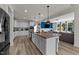 Spacious kitchen features a large island, granite countertops, and an open layout connecting to the living area at 185 Twilight Trl, Willow Springs, NC 27592