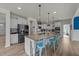 Spacious kitchen with a large island, pendant lighting, stainless appliances and plentiful cabinet space at 185 Twilight Trl, Willow Springs, NC 27592