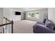 Upstairs loft features comfortable seating, a bookshelf, and a view of the outdoors at 185 Twilight Trl, Willow Springs, NC 27592