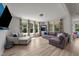 Inviting living room with ample natural light, comfortable seating, and an open layout at 185 Twilight Trl, Willow Springs, NC 27592