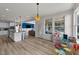 Open concept living space connects a kitchen, living area and patio for seamless indoor-outdoor living at 185 Twilight Trl, Willow Springs, NC 27592