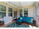 A comfortable screened porch with a seating arrangement and overhead string lights at 185 Twilight Trl, Willow Springs, NC 27592