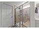 Modern shower featuring a glass enclosure, stylish tile, and a built-in bench at 185 Twilight Trl, Willow Springs, NC 27592