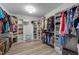 Spacious walk-in closet offers ample storage and organization with shelving and hanging racks at 185 Twilight Trl, Willow Springs, NC 27592