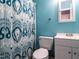 Bathroom with decorative shower curtain, toilet, and vanity at 203 Lane Of Sir Kay, Garner, NC 27529