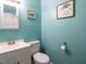 Bathroom with updated vanity, toilet, and mirror at 203 Lane Of Sir Kay, Garner, NC 27529