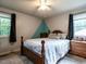 Bedroom with natural light, ceiling fan and decorative molding at 203 Lane Of Sir Kay, Garner, NC 27529