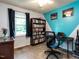 Home office with built-in bookshelf, natural light and desk at 203 Lane Of Sir Kay, Garner, NC 27529