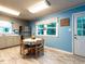 Cozy kitchen with a dining area, modern appliances, and a bright window offering natural light at 203 Lane Of Sir Kay, Garner, NC 27529