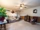 Inviting living room with neutral-toned walls, plush carpeting, a cozy sofa, and decorative accents at 203 Lane Of Sir Kay, Garner, NC 27529