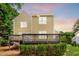 A well maintained backyard with a deck enhances the home's outdoor living space, as well as green shrubs at 2218 Watersglen Dr, Apex, NC 27502