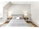 Bedroom featuring a metal bed frame with side tables and lamps at 2218 Watersglen Dr, Apex, NC 27502